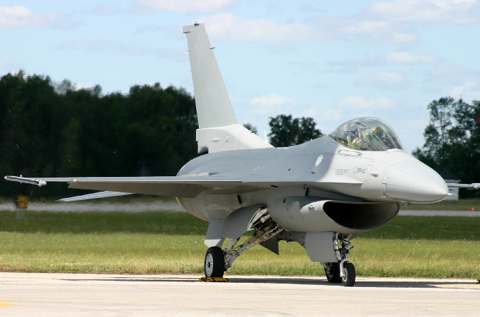 How do you remove sealant from an F-16 jet wing?