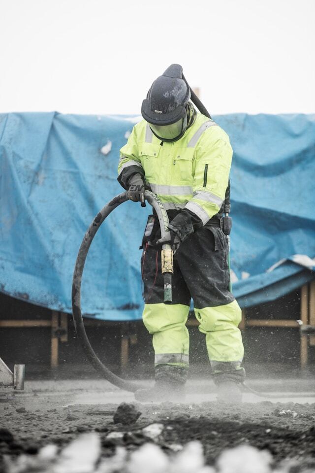 Sandblasting with full PPE suit